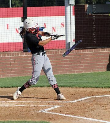 Kinley Rendon breaks her bat after hitting a ball in the Lady Indians' 11-1 win over Lindsay on Monday. (Photo by Todd Brooks)