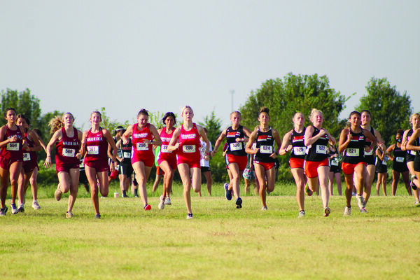 Jaylee Miller, Ryleigh Woody and Sarai Alvarez take off from the starting line at the Duncan cross country meet last Saturday. Miller placed first in the race.