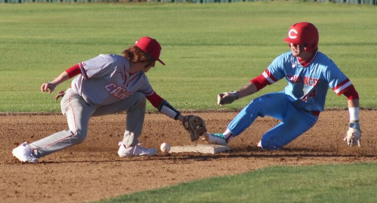 Comanche's Ian Essex slides safely into second base against Cache last Friday.